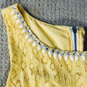 Sleeveless lace dress w beaded neckline